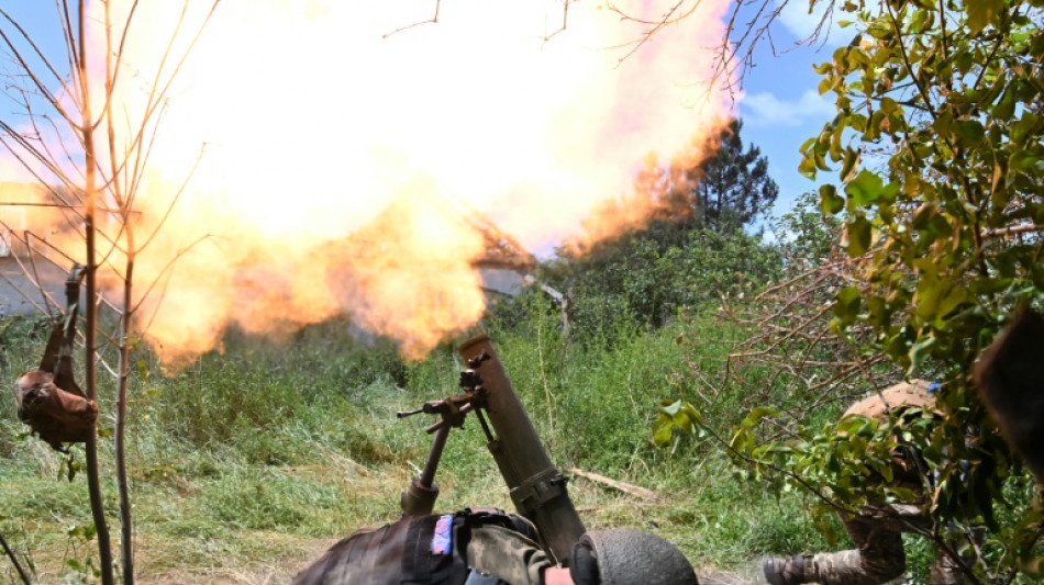 Tank rounds and war trophies as Ukraine shows retaken villages