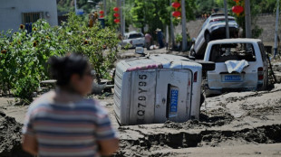 Beijing issues new storm warning after deadly floods