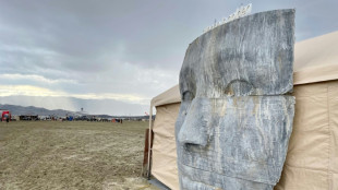 Exodus begins at drenched Burning Man party in US desert
