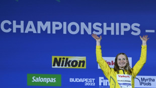 O'Callaghan overcomes 'panic' to win world 100m freestyle title