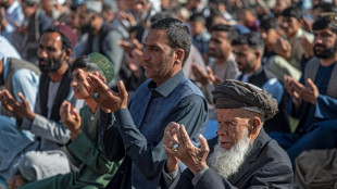 Afghan leader hails 'security' in rare appearance to mark Eid